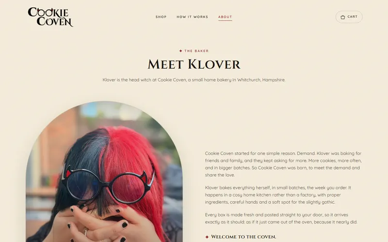 About page with a photo of Klover in round glasses